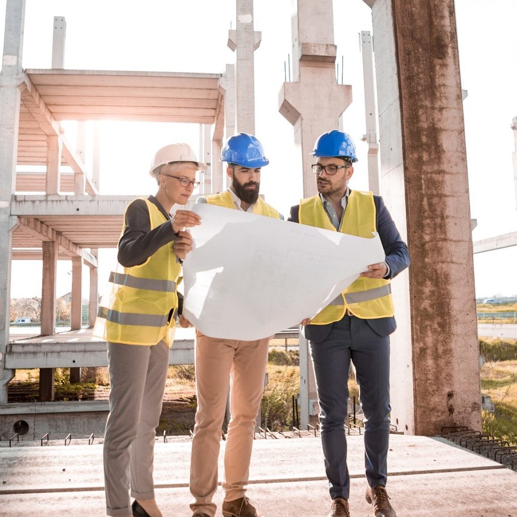 Architects looking at plans on a job site